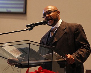 Rev. Kenneth Simon reads scripture to the congregation during the Emancipation Proclamation and Installment service at the New Bethel Baptist Church in Youngstown on Thursday morning.  Dustin Livesay  |  The Vindicator  1/1/15  Youngstown, Ohio.