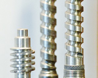 Jeff Lange | The Vindicator  An example of threads ground by Drake machines on display in the lobby of their manufacturing plant.