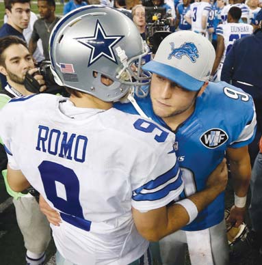 Cowboys quarterback Tony Romo and Lions quarterback Matthew Stafford greet after their wild card playoff game Sunday in Arlington, Texas.