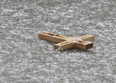 William D. Lewis The Vindicator  Crucifix thrown onto frozen Lake Glacier during annual Orthodox Blessing of the Water at Mill Creek Park  Tuesday 1-6-15.