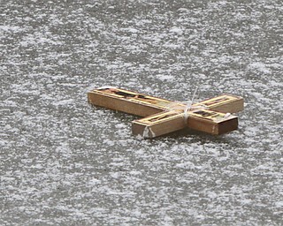 William D. Lewis The Vindicator  Crucifix thrown onto frozen Lake Glacier during annual Orthodox Blessing of the Water at Mill Creek Park  Tuesday 1-6-15.