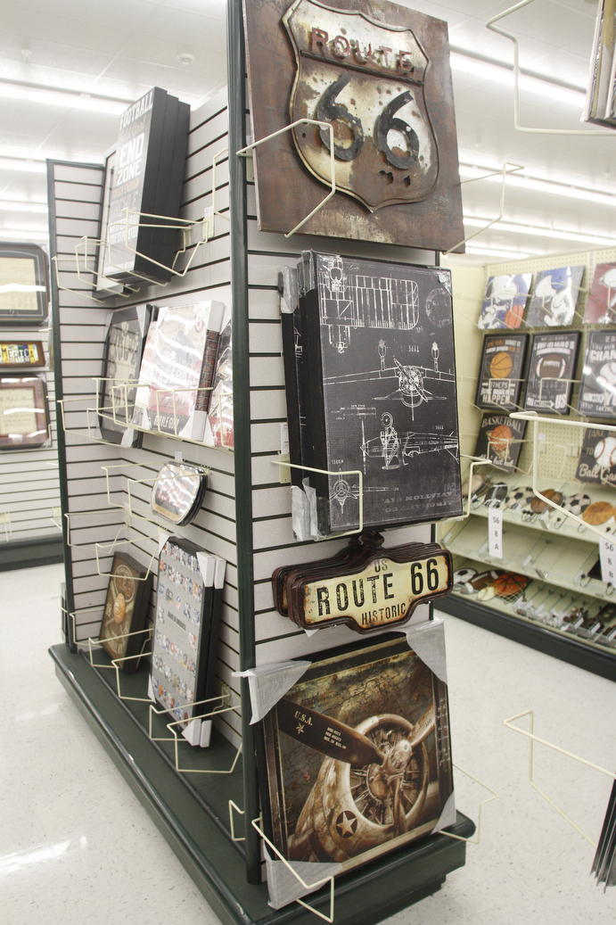        ROBERT K. YOSAY  | THE VINDICATOR..Wall Decorations  a staple of Hobby Lobby..Hobby Lobby opened Monday morning in the new location in Tiffany Square in Boardman at South Ave and 224 .  It closed Saturday at the Boardman Canfield location .