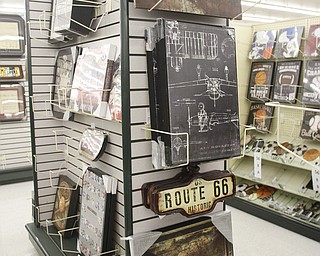        ROBERT K. YOSAY  | THE VINDICATOR..Wall Decorations  a staple of Hobby Lobby..Hobby Lobby opened Monday morning in the new location in Tiffany Square in Boardman at South Ave and 224 .  It closed Saturday at the Boardman Canfield location .