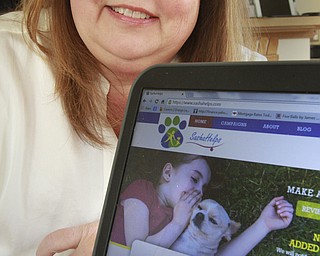 William D. Lewis the vindictor Joni Vernars with her website Sasha helps about her former pet and therapy Dog Sasha.