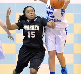 Jeff Lange | The Vindicator  Lakeview's Abby Pavlik (right) gets her fingers on the ball over Warren's Aunjanae Warfield in the third period of Wednesday night's game in Cortland.