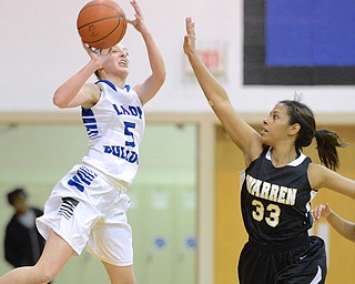 Jeff Lange | The Vindicator  Lakeview's Jensen Silbaugh (5) attempts a half court shot in the final seconds of the third quarter over Warren's Alaska Dykes (33), Wednesday night in Cortland.