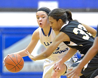 Jeff Lange | The Vindicator  Lakeview's Annie Pavlansky (left) maintains possession of the ball as Warren's Alaska Dykes (33) attempts to steal the ball away from her in the fourth quarter of Wednesday night's game at Lakeview High School.