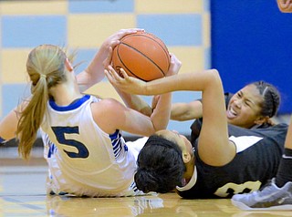 Jeff Lange | The Vindicator  Harding's Gariana Bercheni (facing) reaches out for the ball as a teammate attempts to rip the ball out of the arms of Lakeview's Jensen Silbaugh (5) in the second half of Wednesday night's matchup at Lakeview High School.