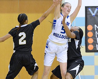 Jeff Lange | The Vindicator  Lakeview's Jensen Silbaugh (5) throws a pass to a teammate over the defense of Harding's Gariana Bercheni (2) and Aunjanae Warfield (right) in the fourth period of Wednesday night's matchup in Cortland.