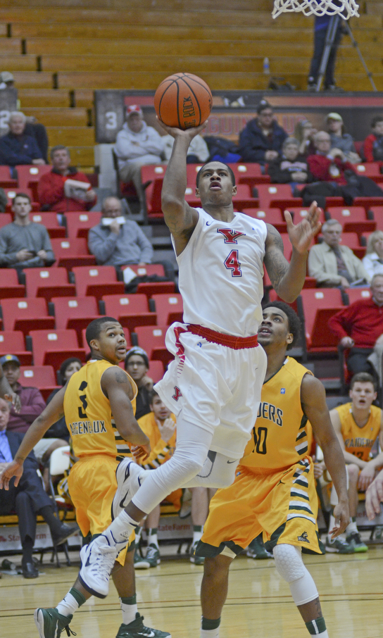 Katie Rickman | The Vindicator.Youngstown's Shawn Amiker (4) goes up for a shot during the first period against Wright State Thursday, January 8, 2015.