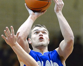 Jeff Lange | The Vindicator  Poland's Austin Wilson looks to the basket as he goes for a two in the second half of their matchup with Boardman, Friday night.