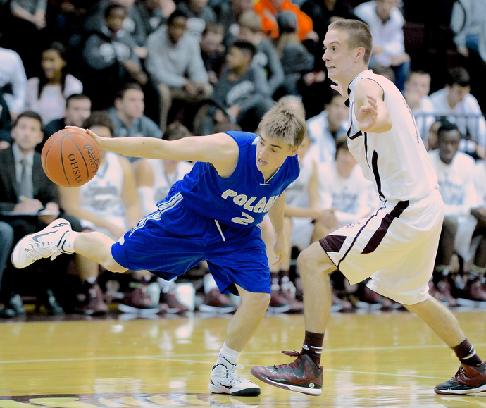 Jeff Lange | The Vindicator  Boardman's John Ryan guards Poland's Nick Romeo (2) as he stretches out to regain possession of the ball in the second half of their matchup, Friday night in Boardman. Poland beat Boardman 58-37.