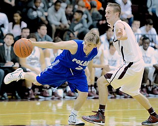 Jeff Lange | The Vindicator  Boardman's John Ryan guards Poland's Nick Romeo (2) as he stretches out to regain possession of the ball in the second half of their matchup, Friday night in Boardman. Poland beat Boardman 58-37.