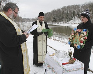 William D. Lewis The Vindicator  Rev. Thomas Constantine, left, Rev Andrew Nelko of St John the Baptist in Campbell and Antonios Constantine during annual Orthodox Blessing of the Water at Mill Creek Park  Tuesday 1-6-15.