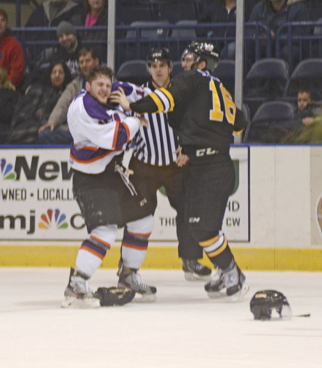Katie Rickman | The Vindicator.Green Bay Gambler's Sam Kauppila(16) takes a swing at Phantom's Josh Nenadal (19) during the first period of the game at the Covelli Centre on Jan. 10, 2015.