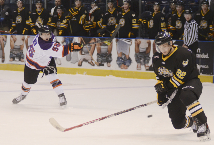 Katie Rickman | The Vindicator.Green Bay Gambler's Jake Kauppila (22) watches a the puck goes past him after Phantom's Ty Farmer (56) took the last shot of the first period on Saturday Jan. 10, 2015.