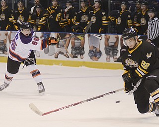 Katie Rickman | The Vindicator.Green Bay Gambler's Jake Kauppila (22) watches a the puck goes past him after Phantom's Ty Farmer (56) took the last shot of the first period on Saturday Jan. 10, 2015.