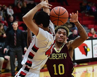 CANFIELD, OHIO - JANUARY 10, 2015: Lynn Bowden #10 of Liberty goes for the basketball after Sam Digiacomo #42 of Canfield loses control during the 2nd half of Saturday nights game at Canfield High School. (Photo by David Dermer/Youngstown Vindicator)