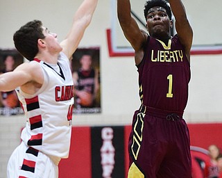 CANFIELD, OHIO - JANUARY 10, 2015: Ben Phillips #1 of Liberty puts up a shot over Mason Mangapora #44 of Canfield during the 2nd half of Saturday nights game at Canfield High School. (Photo by David Dermer/Youngstown Vindicator)