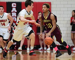 CANFIELD, OHIO - JANUARY 10, 2015: Lynn Bowden #10 of Liberty dribbles up court past Vince Leone #34 of Canfield during the 2nd half of Saturday nights game at Canfield High School. (Photo by David Dermer/Youngstown Vindicator)