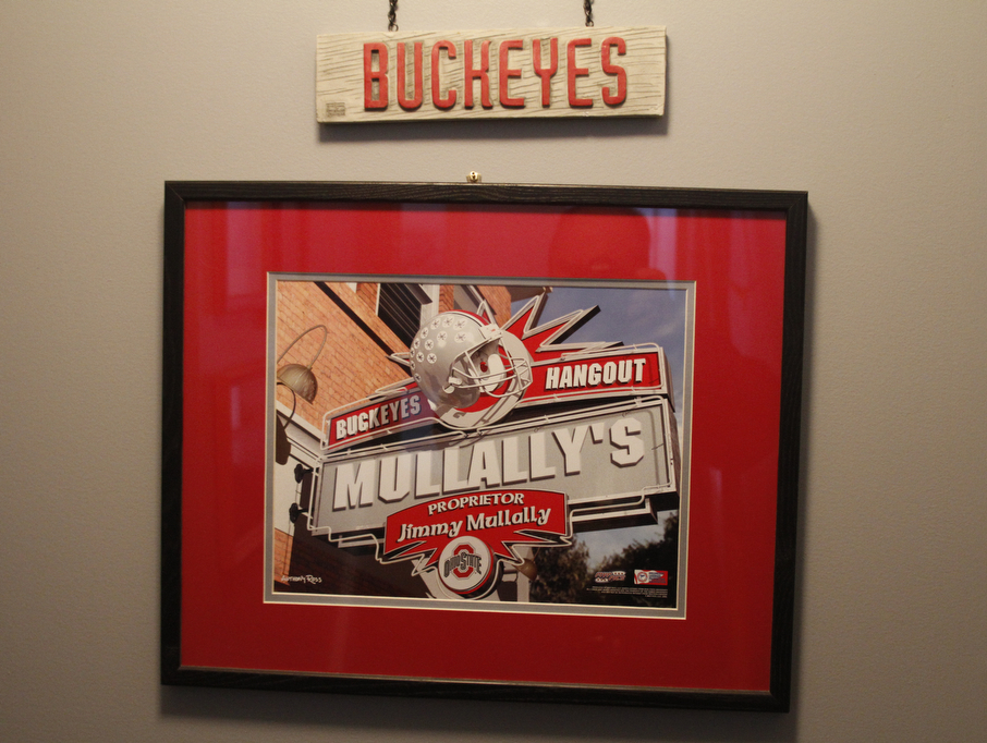        ROBERT K. YOSAY  | THE VINDICATOR..OSU Buckeye Fan Jim Mullally  of Poland and the entrance way to the basement...and his basement painted scarlet and gay a