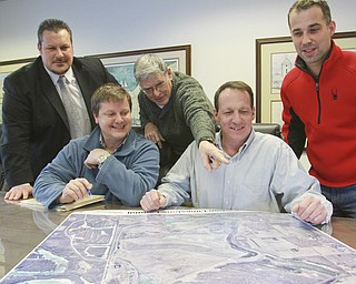 William D. Lewis the Vindicator Skip Members of Poland Activity Center committee look over maps of the area where center is to be built. Front l-r Skip Slavin, Ken Conzett, back l-r Zel Bush, Mike Heher and Ryan McBride.
