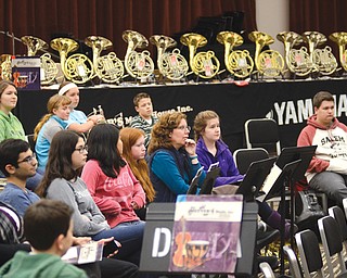 Aspiring French horn players, from middle school students to adults, listen to Stephen Kostyniak, a member of the Pittsburgh Symphony Orchestra, explain some of the intricacies of the instrument during the Third Annual Horn Workshop on Sunday at Dana School of Music in Bliss Hall at Youngstown State University.