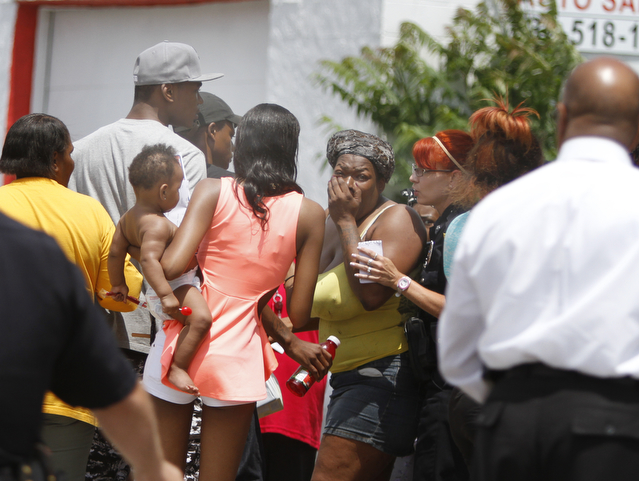        ROBERT K. YOSAY  | THE VINDICATOR.. .The owner of a South Avenue store and a 10-year-old boy were in the wrong place at the wrong time early Wednesday afternoon, as both were wounded as two men were shooting at each other..Both victims were taken to St. Elizabeth Health Center after the shooting at the 3211 South Ave. store about 1:25 p.m..The shooters got away..