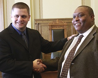 William  D. Lewis The Vindicator Promotion of Chad Zubal,left, from patrolman to detective sergeant and promotion of Ramon Cox from detective to lieutenant during a 1-8-15 ceremony in council chambers..