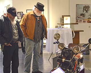 Katie Rickman | The Vindicator.George Kurka of Ravenna (on lefT) and Richard Miller of Akron look at a vintage 1930 Harley Davidson at the Antique Motorcycle Exhibit at the National Packard Museum on Friday evening.
