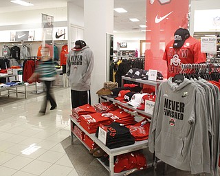        ROBERT K. YOSAY  | THE VINDICATOR...Jacob Rosa puts the new SUGAR BOWL CHAMPION hat on sale at PENNEYS .  along with other Ohio State jerseys etc...