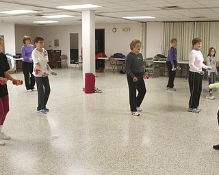        ROBERT K. YOSAY  | THE VINDICATOR..Fitness Fun -The total body workout class at St. Michael Church engages exercisers in warm up, weight trainiung, floor work, low-impact aerobics with s-t-r-e-t-c-h-ing and balancing and a cool-down period, u.Marion Calpin,