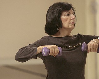        ROBERT K. YOSAY  | THE VINDICATOR..Rosemary Rigby...  does arm extensions with weights..Fitness Fun -The total body workout class at St. Michael Church engages exercisers in warm up, weight trainiung, floor work, low-impact aerobics with s-t-r-e-t-c-h-ing and balancing and a cool-down period, u.Marion Calpin,