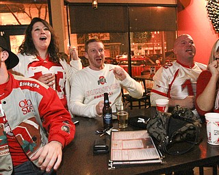 William D. Lewis The Vindicator  OSU fans from left, Matt Firment of McDonald, Ashley Hoffman of Vienna, Joe Murray of Youngstown, Charlie Brown of Niles and Angel Dunch of Howlandwatch OSU game at V2 in Youngstown 1-12-15.