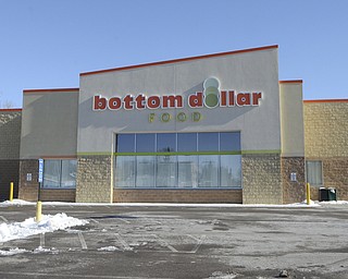 Katie Rickman | The Vindicator.The Bottom Dollar on Glennwood Ave has white paper covering the windows after closing the local stores. The Bottom Dollar stores closed much earlier than what was planned.