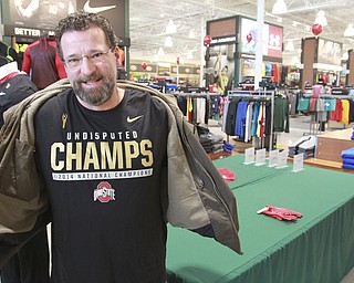 William D Leiws the vindicator  Tom Borton of Mineral Ridge shows of the OSU shirt he bought at Dicks in Boardman early Tuesday 1-13-15. He returnd later in the day to purchase another and found the shelves bare.