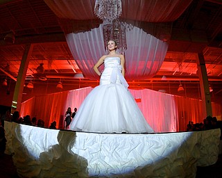 Jeff Lange | The Vindicator  Lauren Martauz of Youngstown poses at the end of the runway wearing White by Vera Wang, Sunday afternoon at the Eastwood Mall during the 2015 Bridal Extravaganza Fashion Show.