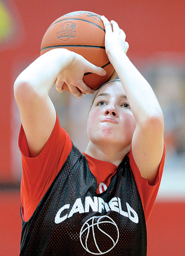 Canfield senior Rachel Tinkey prepares to make a free throw during practice. The four-year Cardinal starter
recently scored her 1,000th point.