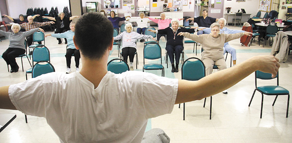 Brian Jones, a certified fitness instructor, leads senior citizens in a movement in the Arthritis Foundation Exercise Program offered at Niles SCOPE Senior Center.