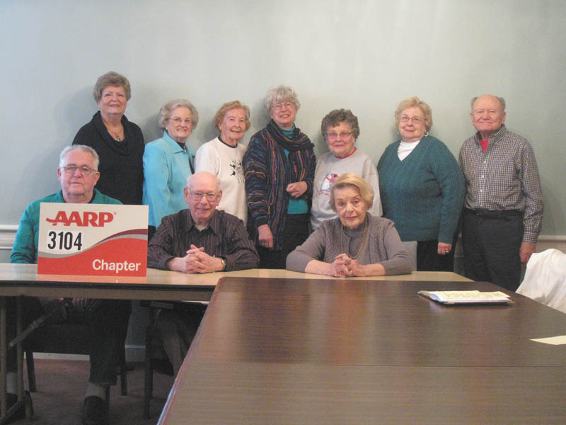 SPECIAL TO THE VINDICATOR — Canfield AARP 3104 installed new officers for the year at its January meeting. Judge Robert Rusu of Mahoning County Probate Court performed the installation. Sitting, from left, are board members Floyd Welker, Bernie Gunter and Mary Ann Cmil. Standing are Janice Bethel, president; Shirley Griffin, vice president; Peg Kelly, assistant secretary; Janice Lesher, secretary; Dorothy Conkle, assistant treasurer; Lois Klein, treasurer; and Richard Hodor, board member. Other board members are Polly Bauman and Chuck Dysert. 