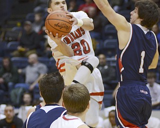 Katie Rickman | The Vindicator.Girard's Chaston Williams (20) goes up for a basket as JFK's Isaac Carrino (1) attempts to block him during the third period at the Covelli Centre on Saturday, Jan. 24, 2015...Also in photo JFK's Michael Roscoe (40) and Girards Logan Cochran  (2).