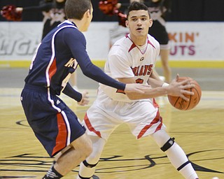 Katie Rickman | The Vindicator.Girards Chaston Williams moves up the court (20) as JFK's Preston Caparanis (4) blocks him during the first period at the Covelli Centre on Jan. 24, 2015.
