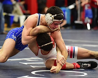 AUSTINTOWN, OHIO - JANUARY 24, 2015:Mitch Tikkanen of Jackson Milton controls the back of Andre Lowey of Shaw during their 113lb championship bout Saturday evening at Fitch High School. (Photo by David Dermer/Youngstown Vindicator)