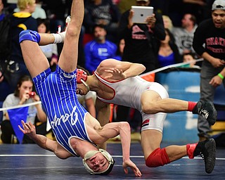 AUSTINTOWN, OHIO - JANUARY 24, 2015:Mitch Tikkanen of Jackson Milton flips over onto his head while being taken down by Andre Lowey of Shaw during their 113lb championship bout Saturday evening at Fitch High School. (Photo by David Dermer/Youngstown Vindicator)