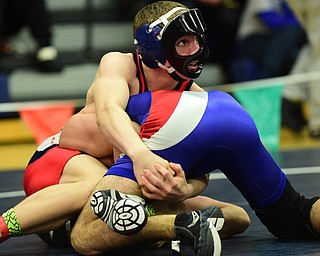 AUSTINTOWN, OHIO - JANUARY 24, 2015: Andrew Fairbanks of Fitch controls the leg of Brogan Lovejoy of Ravenna during their 120lb championship bout Saturday evening at Fitch High School. (Photo by David Dermer/Youngstown Vindicator)