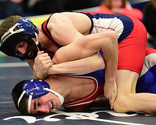 AUSTINTOWN, OHIO - JANUARY 24, 2015: Andrew Fairbanks of Fitch controls the arm and back of Brogan Lovejoy of Ravenna during their 120lb championship bout Saturday evening at Fitch High School. (Photo by David Dermer/Youngstown Vindicator)