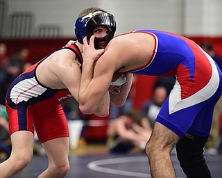 AUSTINTOWN, OHIO - JANUARY 24, 2015: Andrew Fairbanks of Fitch controls the back of the head of Brogan Lovejoy of Ravenna during their 120lb championship bout Saturday evening at Fitch High School. (Photo by David Dermer/Youngstown Vindicator)