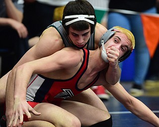 AUSTINTOWN, OHIO - JANUARY 24, 2015: Adam Green of Fitch attempts to escape from the control of Zach Defraine of Medina during their 152lb third place bout Saturday evening at Fitch High School. (Photo by David Dermer/Youngstown Vindicator)