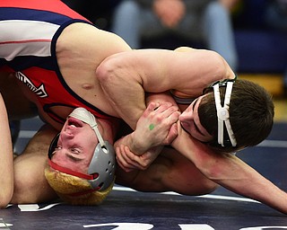AUSTINTOWN, OHIO - JANUARY 24, 2015: Adam Green of Fitch attempts to escape from the control of Zach Defraine of Medina during their 152lb third place bout Saturday evening at Fitch High School. (Photo by David Dermer/Youngstown Vindicator)