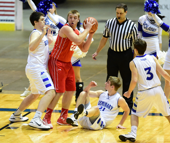 YOUNGSTOWN, OHIO - JANUARY 25, 2014: Trey Staunch #22 of West Middlesex attempts to pass the ball after grabbing a rebound away from Jacob Burns #14, Kyle Dixon #21 and Nick Gajdos #3 of Poland during the first half of Sunday evenings game at Covelli Centre. (Photo by David Dermer/Youngstown Vindicator)